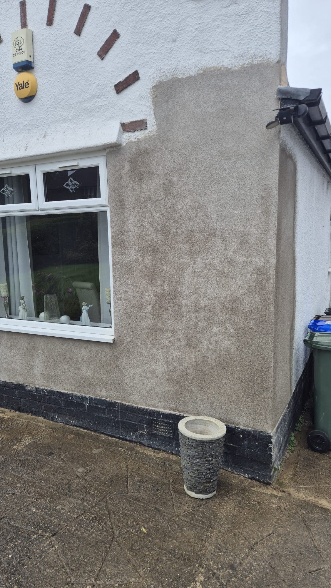 Sand and cement render repair blended into an existing tyrolean-finished wall