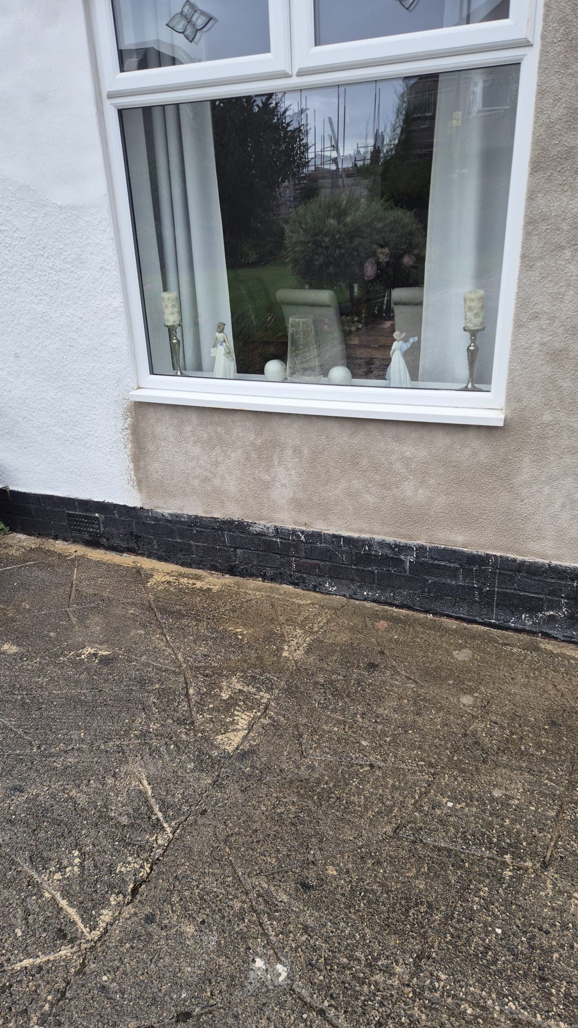 Close-up of new render matching the texture of the surrounding tyrolean finish
